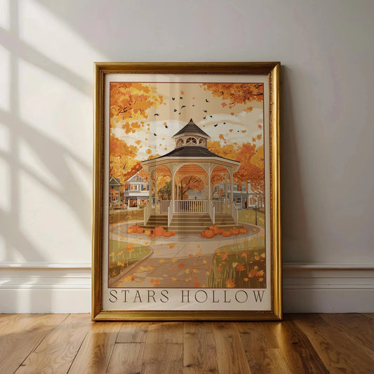 Framed artwork of 'Stars Hollow' with autumn scene on a wall. Canvas & Curio