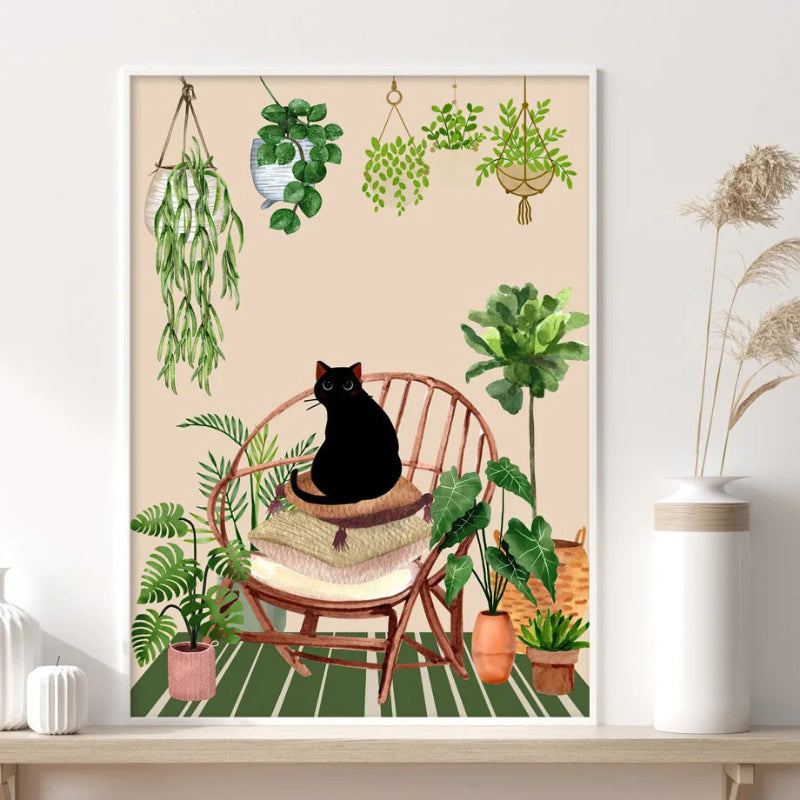 Framed artwork of a black cat on a chair surrounded by plants on a shelf.