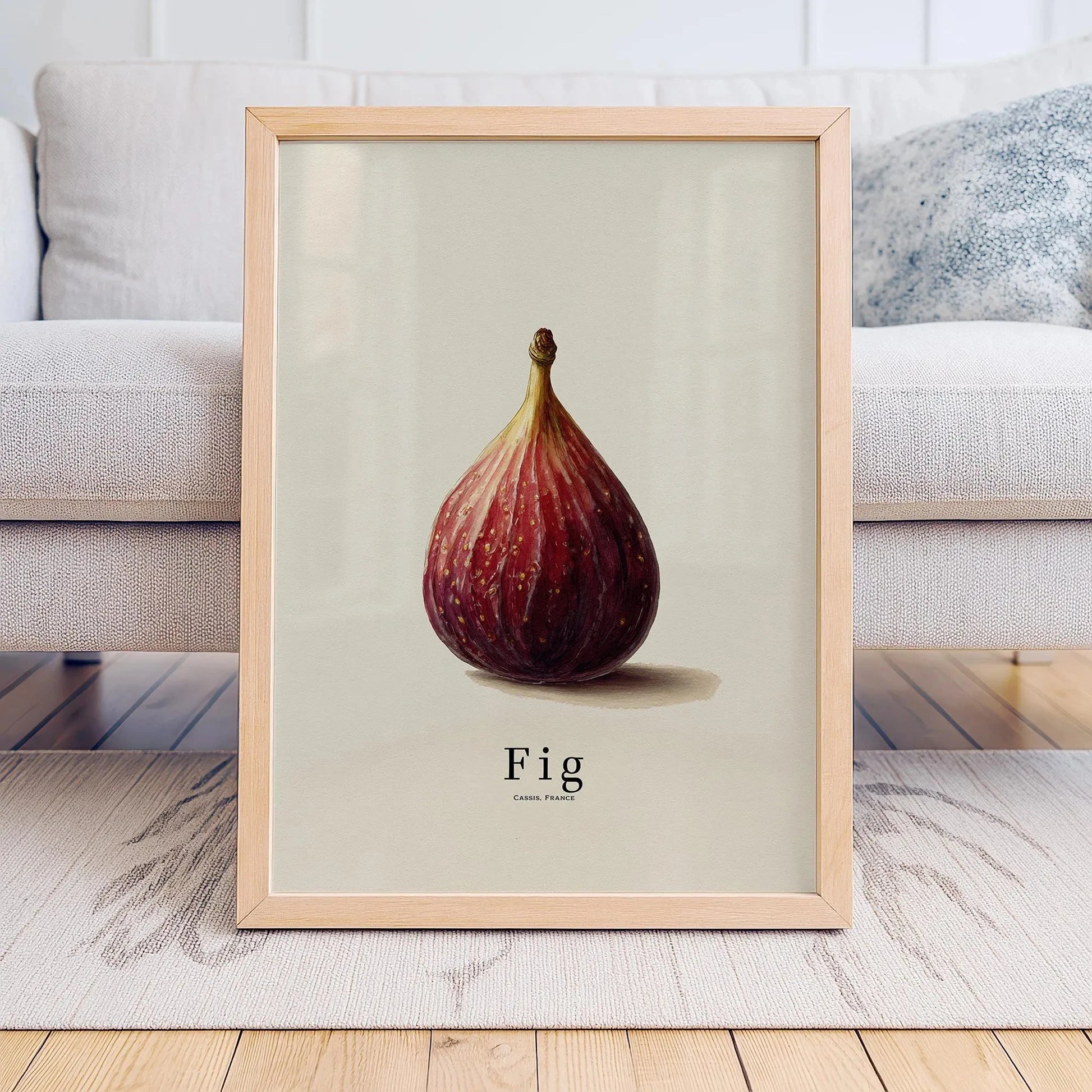Framed artwork of a fig on a neutral background