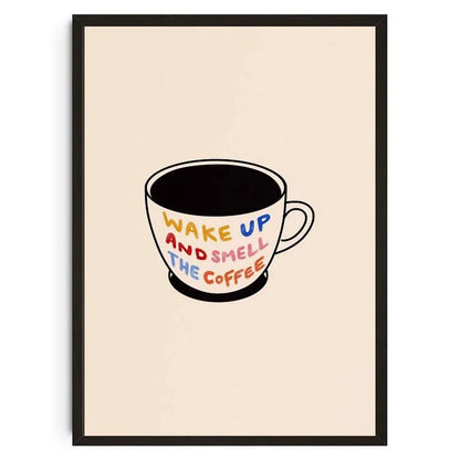 Framed artwork of a coffee cup with 'Wake Up and Smell the Coffee' text on a beige background