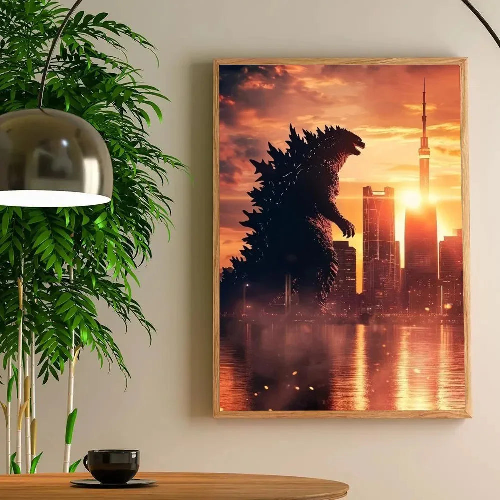 Framed artwork of Godzilla silhouetted against a city skyline with a sunset.