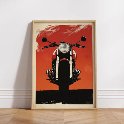 Framed poster of a motorcycle on an orange background, leaning against a white wall.