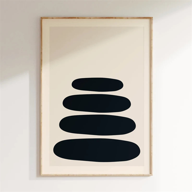 Framed abstract art with black shapes on a beige background