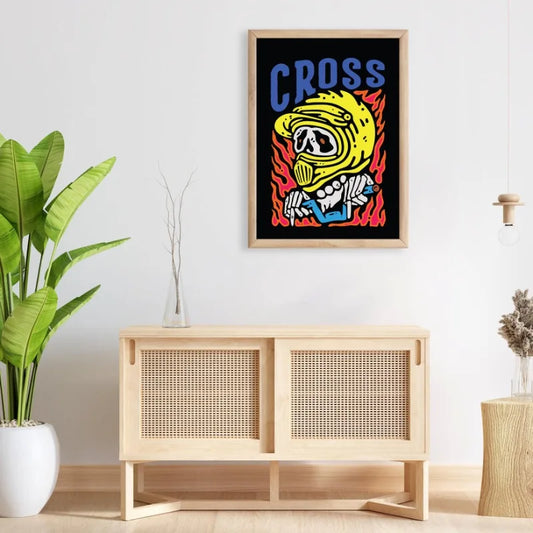 Framed poster with a helmet design above a wooden cabinet in a room. Canvas & Curio