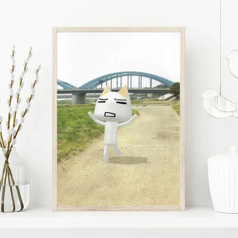 Framed artwork of a cartoon cat character on a path with a bridge in the background