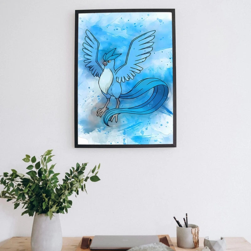 Framed artwork of a blue creature with wings on a white wall above a desk.