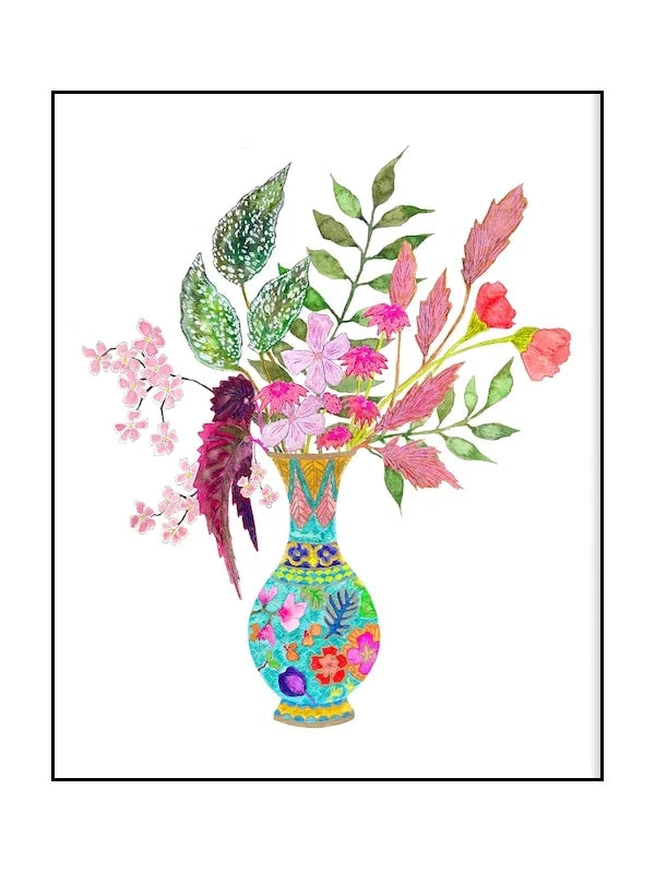 Colorful floral arrangement in a decorative vase on a white background