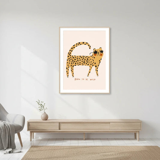 Framed artwork of a cheetah on a wall in a modern living room. Canvas & Curio