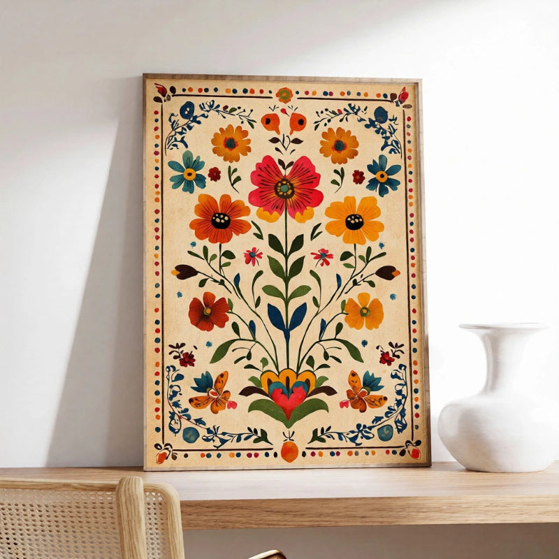 Decorative floral painting on a wooden frame against a white wall with a vase in the background.