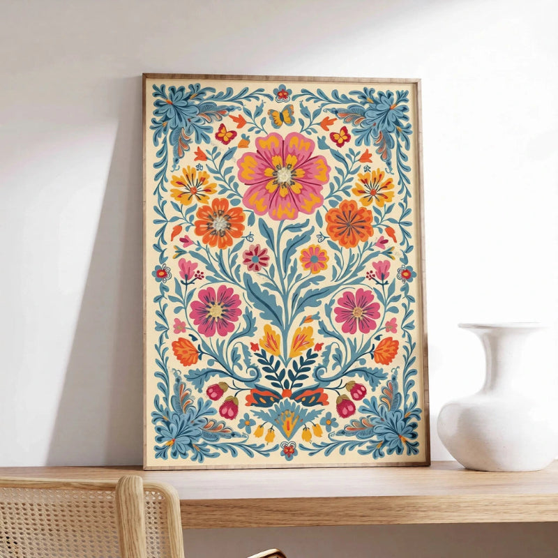 Colorful floral artwork in a wooden frame on a shelf with a white vase.